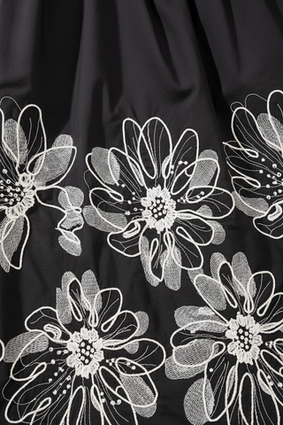 White Floral Embroidery Detail on Black Poplin - Full Frame